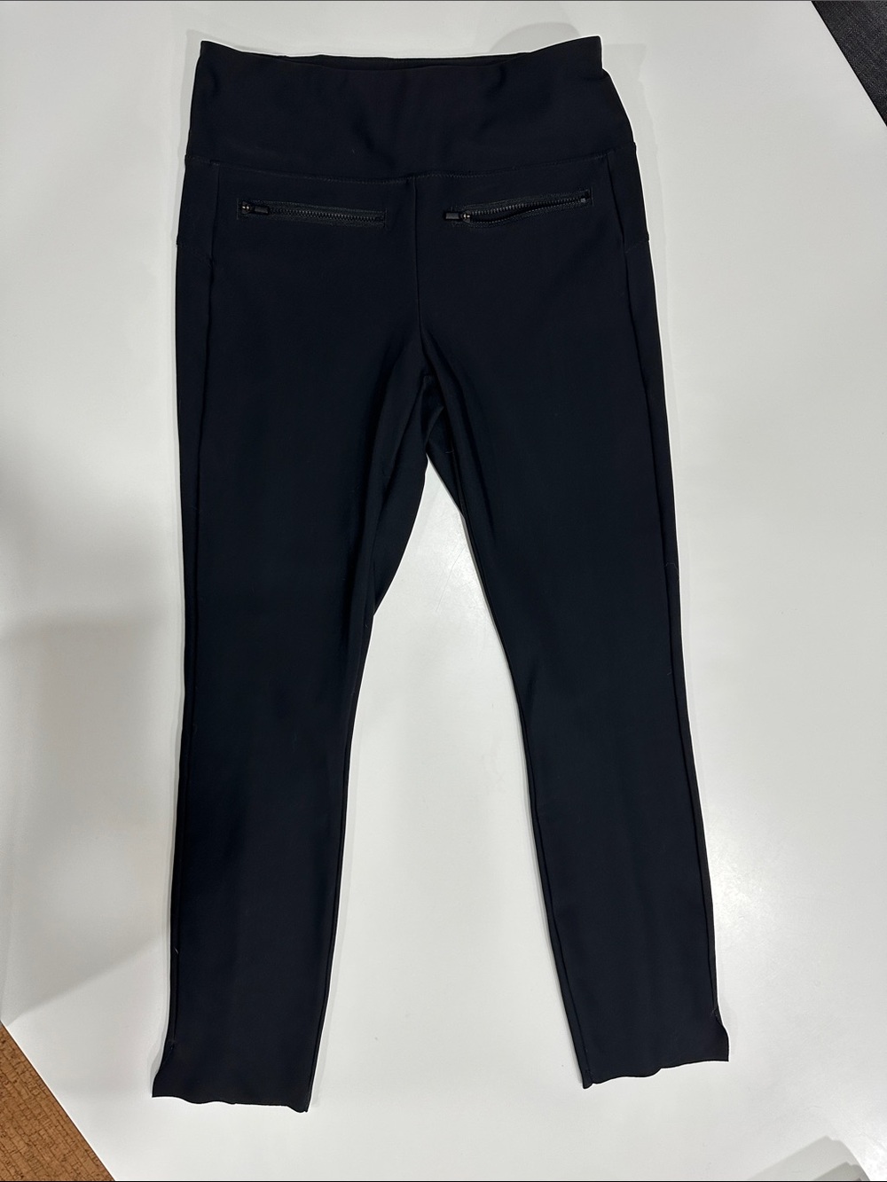 Women’s black Athleta crop pants stand out with their sleek front